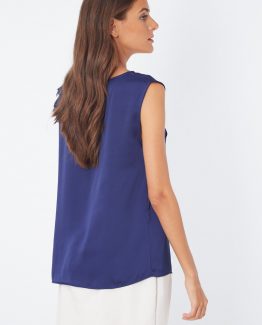 Blusa satinada con flor en el hombro - Tutto Tempo